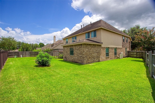 3922 Crestwind Ln, Richmond, TX 77407 - back of property featuring brick siding and a fenced backyard