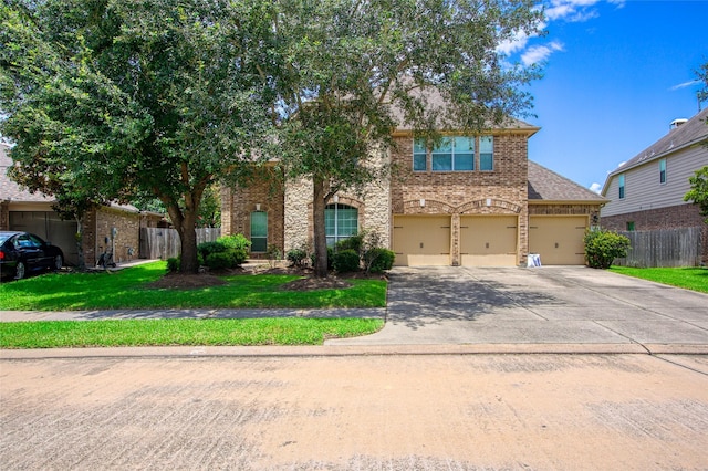 3922 Crestwind Ln, Richmond, TX 77407 - view of front facade featuring an attached garage, driveway, and brick siding