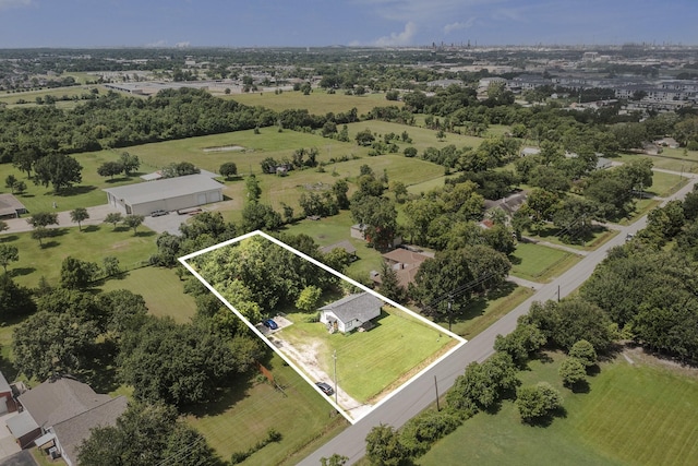 418 E Cedar Bayou Lynchburg Rd, Baytown, TX 77521 - aerial view of property and surrounding area featuring property parcel outlined and a tree filled landscape