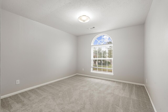 6209 S Fawnlake Dr, Katy, TX 77493 - empty room with carpet flooring and a textured ceiling