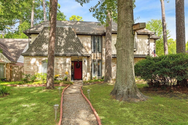 14615 Sunny Grove Dr, Houston, TX 77070 - view of front of home featuring roof with shingles, brick siding, and a front yard