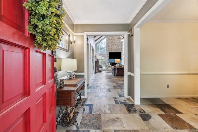 14615 Sunny Grove Dr, Houston, TX 77070 - foyer entrance with stone tile floors, a ceiling fan, crown molding, and a textured ceiling