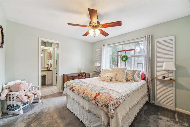 14615 Sunny Grove Dr, Houston, TX 77070 - carpeted bedroom featuring ensuite bathroom and ceiling fan