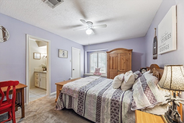 14615 Sunny Grove Dr, Houston, TX 77070 - bedroom with carpet flooring, connected bathroom, a ceiling fan, and a textured ceiling
