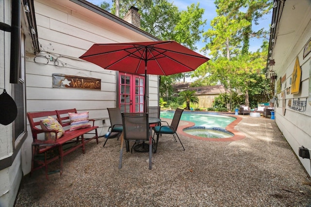 14615 Sunny Grove Dr, Houston, TX 77070 - view of patio / terrace with french doors and a pool with connected hot tub