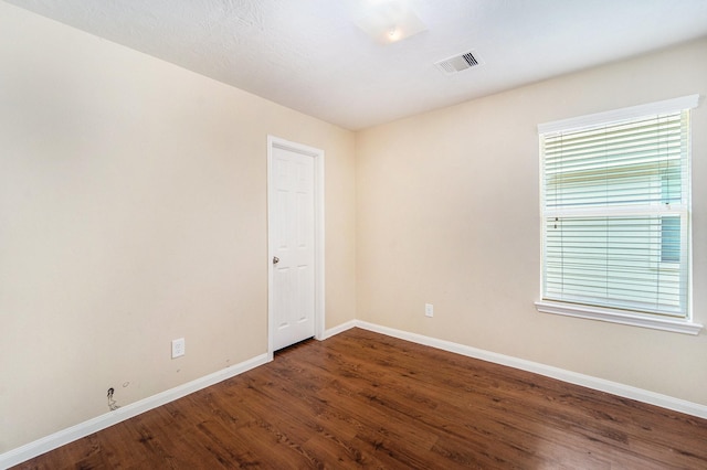12006 Gregory Crossing Way, Houston, TX 77067 - spare room featuring baseboards and wood finished floors
