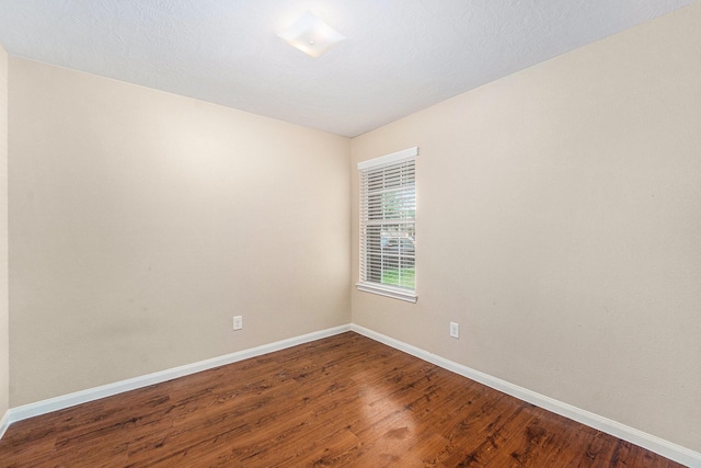 12006 Gregory Crossing Way, Houston, TX 77067 - spare room with baseboards and wood finished floors