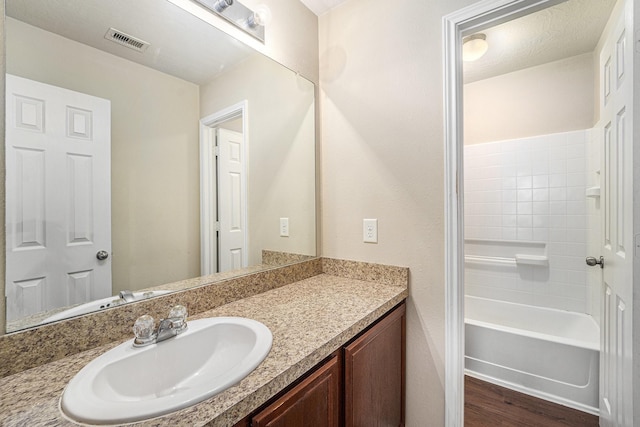 12006 Gregory Crossing Way, Houston, TX 77067 - bathroom with vanity and wood finished floors