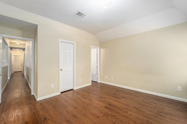12006 Gregory Crossing Way, Houston, TX 77067 - unfurnished bedroom with dark wood finished floors and vaulted ceiling