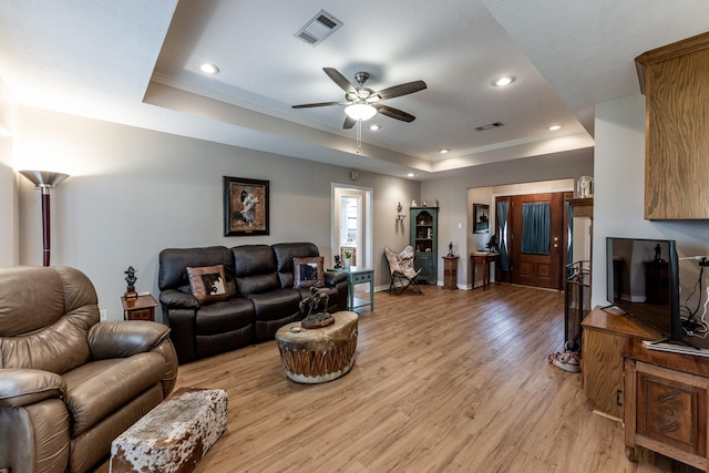 1608 Durham Dr, Huntsville, TX 77340 - living area featuring a raised ceiling, light wood-style flooring, recessed lighting, crown molding, and a ceiling fan