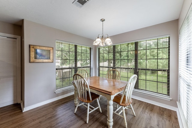 1608 Durham Dr, Huntsville, TX 77340 - dining room with a chandelier, wood finished floors, and plenty of natural light