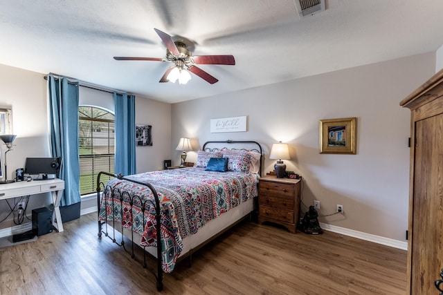1608 Durham Dr, Huntsville, TX 77340 - bedroom featuring wood finished floors, ceiling fan, and an office area