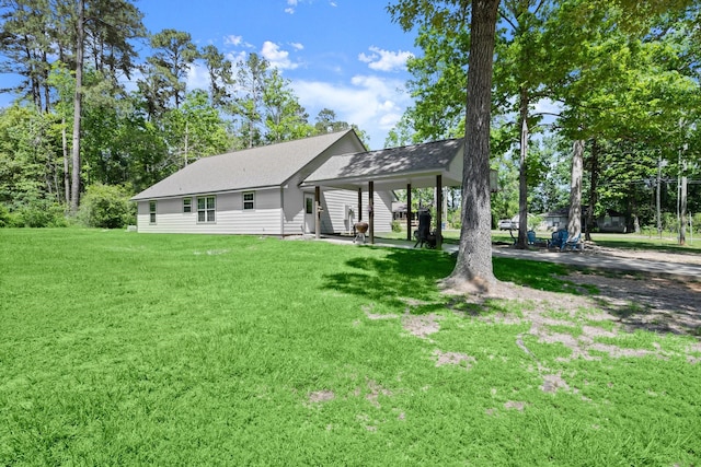 683 Cross Timbers, Livingston, TX 77351 - back of property with a yard and roof with shingles