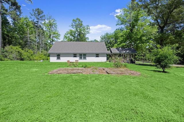 683 Cross Timbers, Livingston, TX 77351 - back of house featuring a lawn