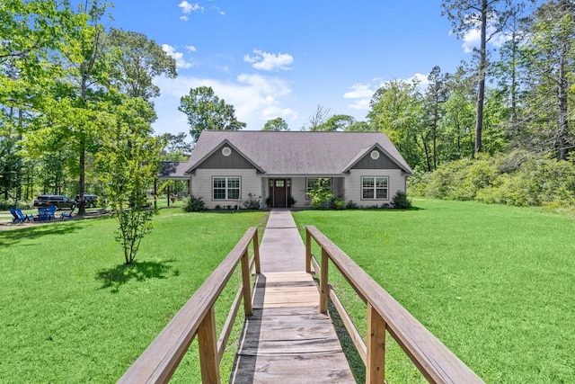 683 Cross Timbers, Livingston, TX 77351 - rear view of property with a lawn and a shingled roof