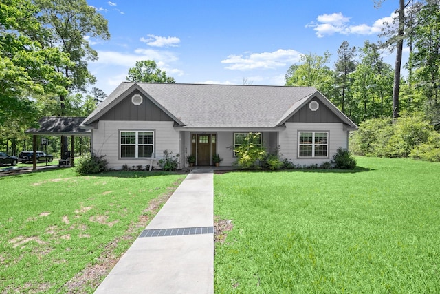 683 Cross Timbers, Livingston, TX 77351 - single story home with board and batten siding, a front yard, and a shingled roof