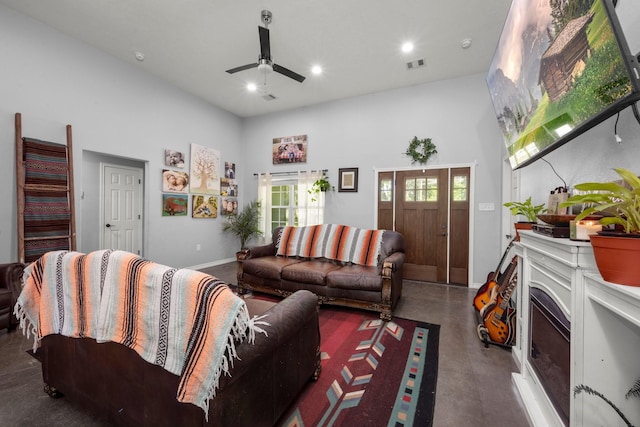 683 Cross Timbers, Livingston, TX 77351 - living room with concrete floors, a ceiling fan, a high ceiling, and recessed lighting