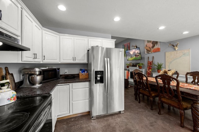 683 Cross Timbers, Livingston, TX 77351 - kitchen with stainless steel appliances, finished concrete floors, white cabinetry, recessed lighting, and dark countertops