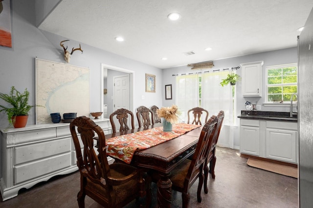683 Cross Timbers, Livingston, TX 77351 - dining area featuring recessed lighting and concrete floors