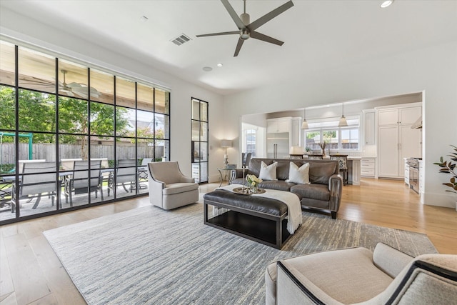6626 Westchester Ave, West University Place, TX 77005 - living room with ceiling fan, light wood-type flooring, and recessed lighting