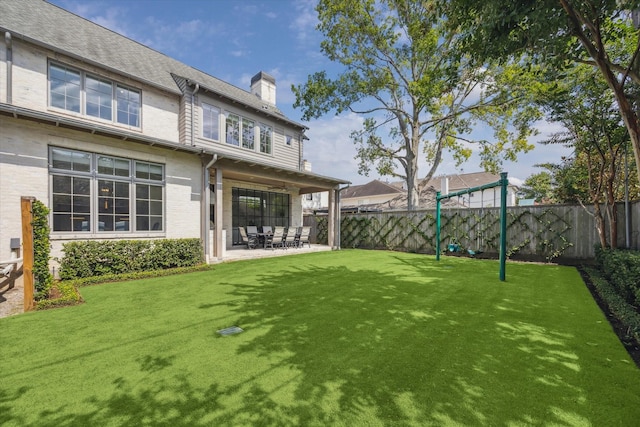 6626 Westchester Ave, West University Place, TX 77005 - back of house with a chimney, a fenced backyard, and a patio