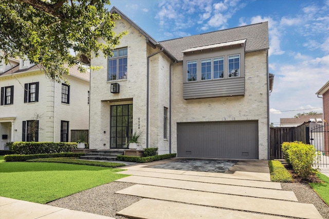 6626 Westchester Ave, West University Place, TX 77005 - view of front of house with driveway, a garage, stucco siding, and a shingled roof