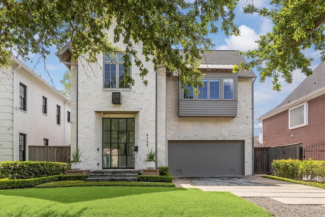 6626 Westchester Ave, West University Place, TX 77005 - view of front of home featuring driveway, an attached garage, and stucco siding