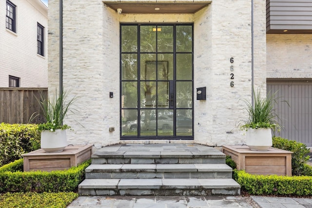 6626 Westchester Ave, West University Place, TX 77005 - view of exterior entry featuring a porch and a garage