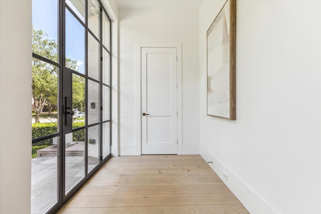 6626 Westchester Ave, West University Place, TX 77005 - corridor with light wood finished floors and baseboards
