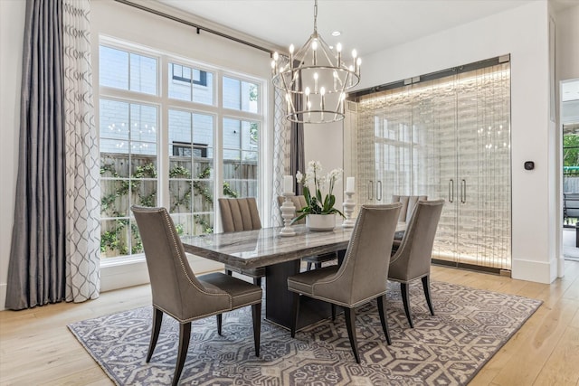 6626 Westchester Ave, West University Place, TX 77005 - dining space with a chandelier and hardwood / wood-style flooring