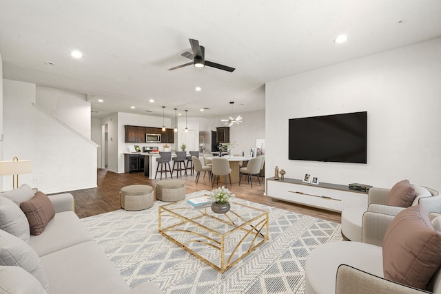 5122 Moonlit Garden Ln, Katy, TX 77449 - living room featuring a ceiling fan, wood finished floors, and recessed lighting