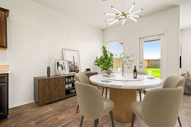 5122 Moonlit Garden Ln, Katy, TX 77449 - dining area featuring dark wood finished floors and baseboards
