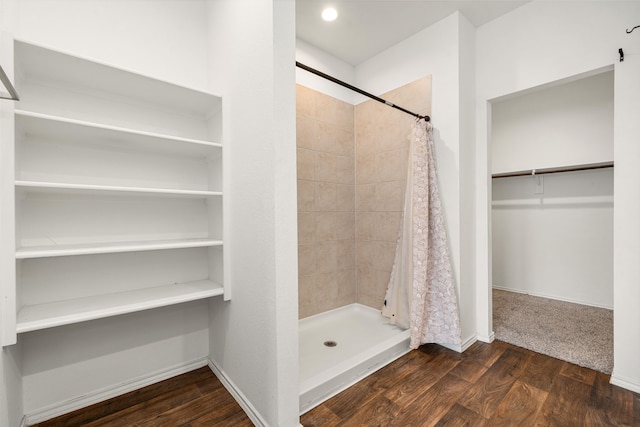 5122 Moonlit Garden Ln, Katy, TX 77449 - full bath featuring a stall shower, a walk in closet, and wood finished floors