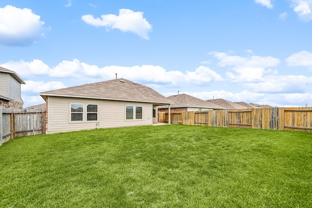 5122 Moonlit Garden Ln, Katy, TX 77449 - back of property with a fenced backyard and a shingled roof