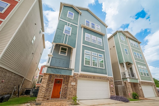 2106 Bidwell Dr, Houston, TX 77018 - view of front facade with brick siding, an attached garage, and driveway