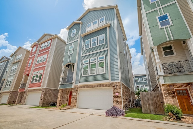 2106 Bidwell Dr, Houston, TX 77018 - view of front of house with an attached garage, brick siding, and driveway