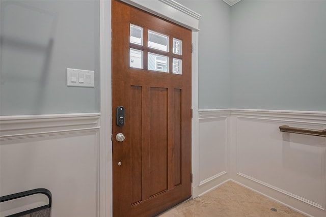 2106 Bidwell Dr, Houston, TX 77018 - foyer featuring a decorative wall, light tile patterned floors, and a wainscoted wall