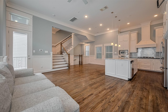 2106 Bidwell Dr, Houston, TX 77018 - kitchen featuring open floor plan, dark wood-type flooring, stainless steel appliances, an island with sink, and custom range hood