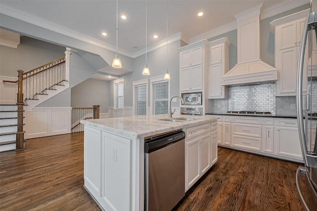 2106 Bidwell Dr, Houston, TX 77018 - kitchen with stainless steel appliances, custom range hood, white cabinets, dark wood-style floors, and hanging light fixtures