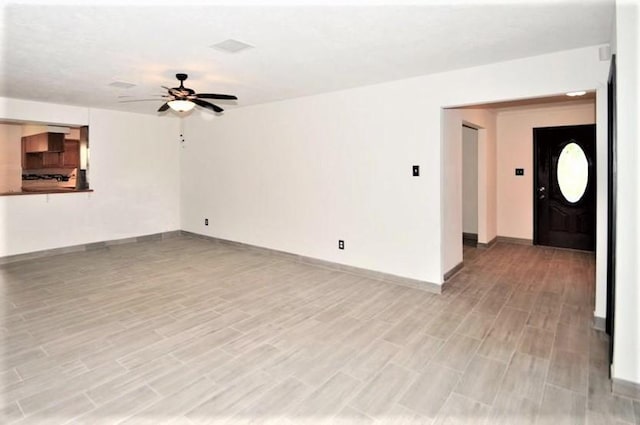 2004 Sleepy Hollow Dr, Pearland, TX 77581 - unfurnished living room with a ceiling fan and light wood finished floors