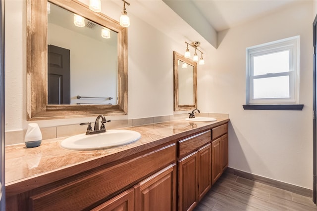 2004 Sleepy Hollow Dr, Pearland, TX 77581 - full bathroom featuring double vanity and wood finished floors