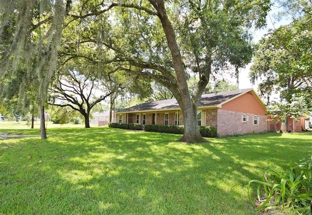 2004 Sleepy Hollow Dr, Pearland, TX 77581 - view of front of house with brick siding and a front yard