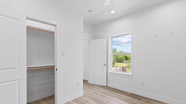 1719 Esther St B, Unit A, Houston, TX 77088 - unfurnished bedroom with wood finished floors and a ceiling fan