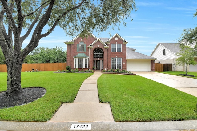 17422 Sunset Arbor Dr, Tomball, TX 77377 - traditional-style home featuring brick siding, driveway, and a garage