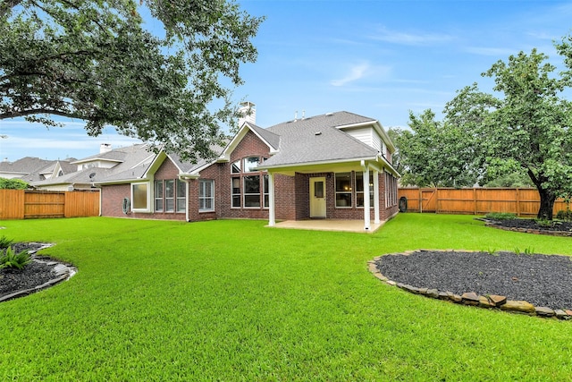 17422 Sunset Arbor Dr, Tomball, TX 77377 - rear view of house with a patio, brick siding, and a fenced backyard