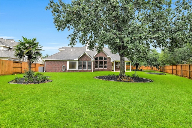 17422 Sunset Arbor Dr, Tomball, TX 77377 - back of house with a fenced backyard and brick siding