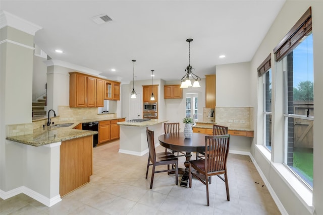17422 Sunset Arbor Dr, Tomball, TX 77377 - kitchen featuring stainless steel microwave, dishwasher, plenty of natural light, tasteful backsplash, and recessed lighting