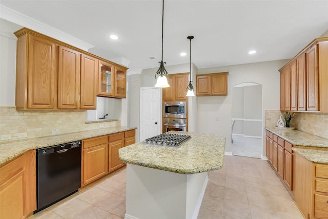 17422 Sunset Arbor Dr, Tomball, TX 77377 - kitchen with stainless steel appliances, a kitchen island, decorative backsplash, light stone countertops, and glass insert cabinets