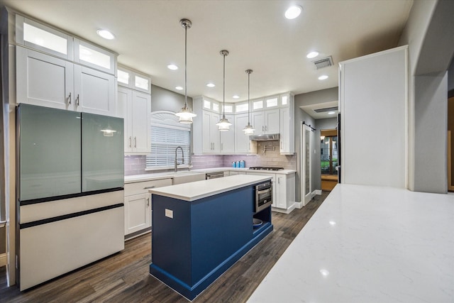 1611 Barrington Hills Ln, Katy, TX 77450 - kitchen featuring freestanding refrigerator, white cabinets, tasteful backsplash, dark wood-type flooring, and recessed lighting