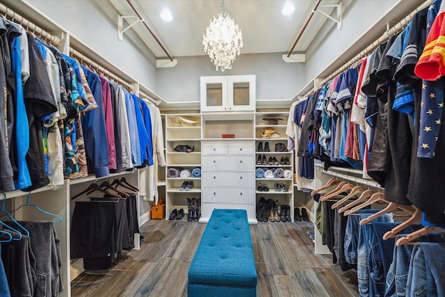 1611 Barrington Hills Ln, Katy, TX 77450 - walk in closet featuring a chandelier and wood finished floors